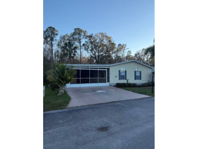 Lovely large home nestled in a wooded setting of The Hamptons on Hamptons Golf Club in Florida - for sale on GolfHomes.com, golf home, golf lot