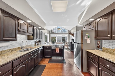 Welcome to this gorgeous 4-bedroom, 3.5-bathroom brick home on Houndslake Country Club in South Carolina - for sale on GolfHomes.com, golf home, golf lot