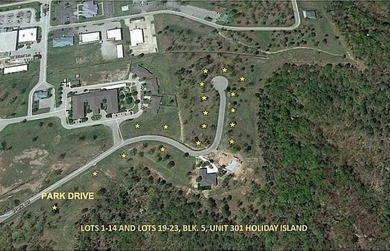 Nestled along a quiet curve within a beautifully established on Holiday Island Golf Course in Arkansas - for sale on GolfHomes.com, golf home, golf lot