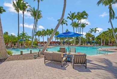 Luxury 2nd-floor unit overlooking JW Marriott Hammock Bay golf on Hammock Bay in Florida - for sale on GolfHomes.com, golf home, golf lot