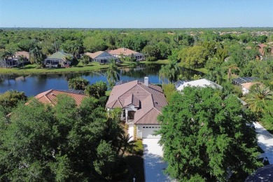 Exquisite three bedroom home with saltwater pool located behind on University Park Country Club in Florida - for sale on GolfHomes.com, golf home, golf lot
