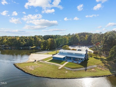 Experience the ultimate in lakeside living with this stunning on River Golf and Country Club at Lake Royale in North Carolina - for sale on GolfHomes.com, golf home, golf lot