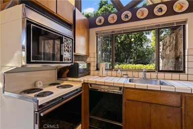 Step back in time with this iconic 1970s custom A-frame lake on Buckingham Golf and Country Club in California - for sale on GolfHomes.com, golf home, golf lot