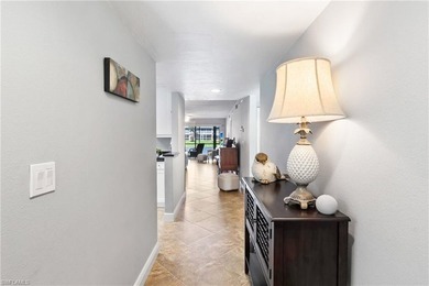 This beautifully updated lakefront residence is located in Abbey on Imperial Golf Club in Florida - for sale on GolfHomes.com, golf home, golf lot