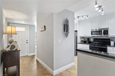 This beautifully updated lakefront residence is located in Abbey on Imperial Golf Club in Florida - for sale on GolfHomes.com, golf home, golf lot