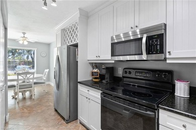 This beautifully updated lakefront residence is located in Abbey on Imperial Golf Club in Florida - for sale on GolfHomes.com, golf home, golf lot