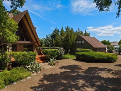 Step back in time with this iconic 1970s custom A-frame lake on Buckingham Golf and Country Club in California - for sale on GolfHomes.com, golf home, golf lot