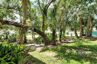 One or more photo(s) has been virtually staged. Tucked away in a on University Park Country Club in Florida - for sale on GolfHomes.com, golf home, golf lot