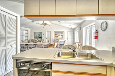 One or more photo(s) has been virtually staged. Tucked away in a on University Park Country Club in Florida - for sale on GolfHomes.com, golf home, golf lot