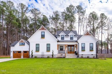 Welcome to this stunning and charming farmhouse-style, perfectly on River Golf and County Club at Lake Royale in North Carolina - for sale on GolfHomes.com, golf home, golf lot