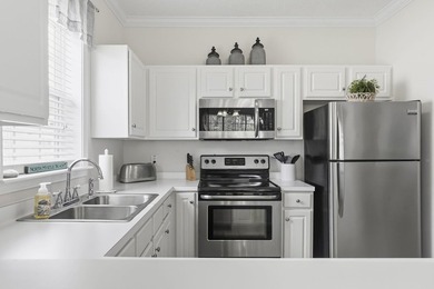 Beautiful and updated light bright third floor end unit in one on Barefoot Resort and Golf Club  in South Carolina - for sale on GolfHomes.com, golf home, golf lot