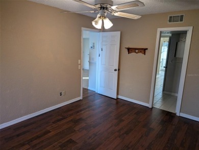 Golf course living at its finest! This charming first-floor on Deep Creek Golf Club in Florida - for sale on GolfHomes.com, golf home, golf lot