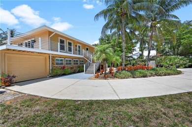 Welcome to your private tropical retreat overlooking Salt Leaf on Raptor Bay Golf Club in Florida - for sale on GolfHomes.com, golf home, golf lot