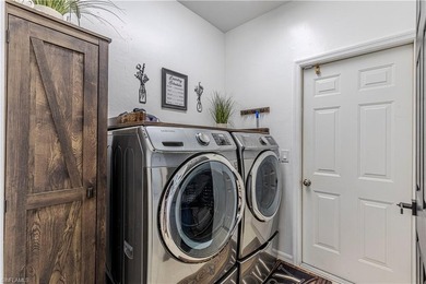 One of the BEST PRICED golf course pool homes in Royal Palm Golf on Eagle Lakes Golf Club in Florida - for sale on GolfHomes.com, golf home, golf lot