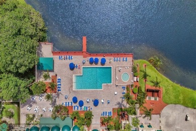 Beautiful lake view 2BR/2BA condo in Pine Island Ridge! Spacious on Pine Island Ridge Country Club in Florida - for sale on GolfHomes.com, golf home, golf lot