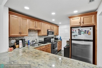 Beautiful lake view 2BR/2BA condo in Pine Island Ridge! Spacious on Pine Island Ridge Country Club in Florida - for sale on GolfHomes.com, golf home, golf lot