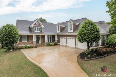 This spacious, move-in ready home is located on a pond and on Traditions of Braselton Golf Club in Georgia - for sale on GolfHomes.com, golf home, golf lot