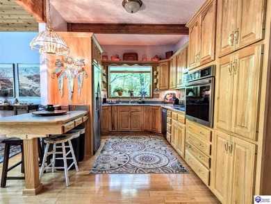 Welcome back to this exceptional Lindal Cedar Home, masterfully on Doe Valley Country Club in Kentucky - for sale on GolfHomes.com, golf home, golf lot