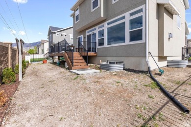 Location is everything! This beautiful 2-story home sits on a on Stansbury Park Golf Club in Utah - for sale on GolfHomes.com, golf home, golf lot
