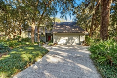 Nestled among scenic tree canopy, this remarkable custom home on Fernandina Beach Golf Club in Florida - for sale on GolfHomes.com, golf home, golf lot