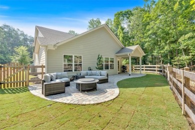 Discover the charm of this nearly new 2023 craftsman-style home on The Highlands Course at Lake Arrowhead in Georgia - for sale on GolfHomes.com, golf home, golf lot