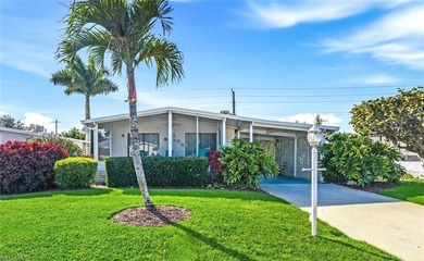 This polished home has updates throughout, a screened-in lanai on Riviera Golf Club in Florida - for sale on GolfHomes.com, golf home, golf lot