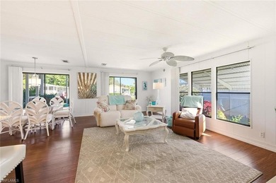This polished home has updates throughout, a screened-in lanai on Riviera Golf Club in Florida - for sale on GolfHomes.com, golf home, golf lot