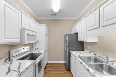 Wake up each morning to peaceful views of the lake and the golf on Arrowhead Country Club in South Carolina - for sale on GolfHomes.com, golf home, golf lot