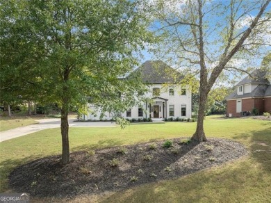 Absolutely stunning two-story home situated on the 6th fairway on Royal Lakes Golf and Country Club in Georgia - for sale on GolfHomes.com, golf home, golf lot