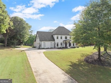 Absolutely stunning two-story home situated on the 6th fairway on Royal Lakes Golf and Country Club in Georgia - for sale on GolfHomes.com, golf home, golf lot