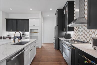Stunning, modern-contemporary Point Venture home nestled just on Point Venture Golf Club on Lake Travis in Texas - for sale on GolfHomes.com, golf home, golf lot