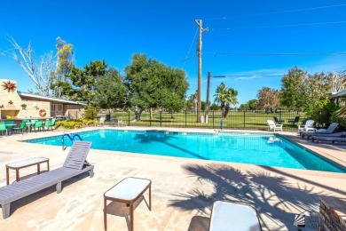 Beautifuly maintained home with picture windows to covered patio on Yuma Golf and Country Club in Arizona - for sale on GolfHomes.com, golf home, golf lot