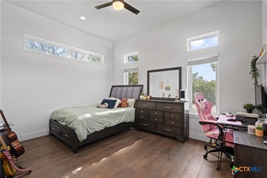 Stunning, modern-contemporary Point Venture home nestled just on Point Venture Golf Club on Lake Travis in Texas - for sale on GolfHomes.com, golf home, golf lot