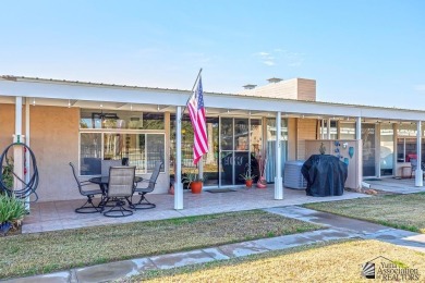 Beautifuly maintained home with picture windows to covered patio on Yuma Golf and Country Club in Arizona - for sale on GolfHomes.com, golf home, golf lot