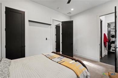 Stunning, modern-contemporary Point Venture home nestled just on Point Venture Golf Club on Lake Travis in Texas - for sale on GolfHomes.com, golf home, golf lot