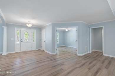 Come explore this beautifully renovated 3,100-square-foot home on Sea Trail Golf Resort in North Carolina - for sale on GolfHomes.com, golf home, golf lot