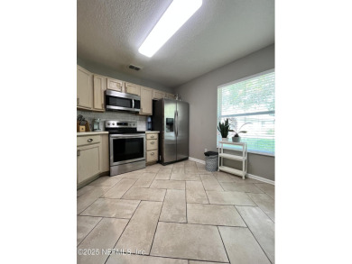 Here is your opportunity to own an end unit one-level townhome on Golf Club At Fleming Island in Florida - for sale on GolfHomes.com, golf home, golf lot