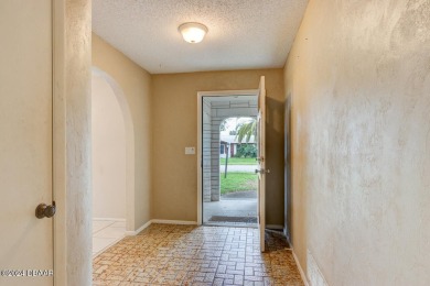 Opportunity knocking. Easy care tiled front entrance foyer (11'x on Daytona Beach Golf Club in Florida - for sale on GolfHomes.com, golf home, golf lot