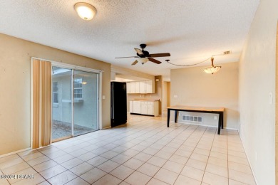 Opportunity knocking. Easy care tiled front entrance foyer (11'x on Daytona Beach Golf Club in Florida - for sale on GolfHomes.com, golf home, golf lot