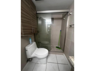 BEAUTIFUL 1 BEDROOM 1.5 BATHROOM SCREENED BALCONY WITH A on Presidential Estate Golf Course in Florida - for sale on GolfHomes.com, golf home, golf lot
