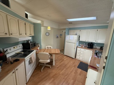 This well-cared for 2-bedroom, 2-bathroom home is being sold on Del Tura Golf and Country Club in Florida - for sale on GolfHomes.com, golf home, golf lot