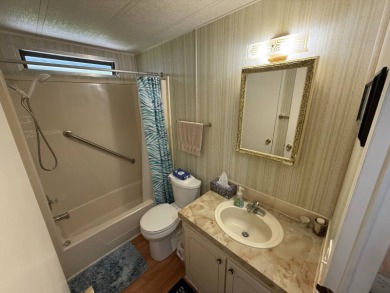 This well-cared for 2-bedroom, 2-bathroom home is being sold on Del Tura Golf and Country Club in Florida - for sale on GolfHomes.com, golf home, golf lot