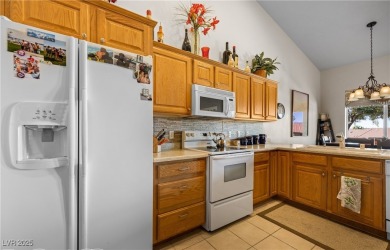 This immaculate, fully furnished townhome sits above the 15th on Wolf Creek At Paradise Canyon in Nevada - for sale on GolfHomes.com, golf home, golf lot