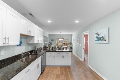 Welcome home to this beautifully maintained 5-bedroom, 3 full on Heron Point Golf Club in South Carolina - for sale on GolfHomes.com, golf home, golf lot