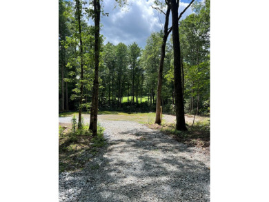 Beautiful flat building lot on the golf course of Wade Hampton on Wade Hampton Golf Club in North Carolina - for sale on GolfHomes.com, golf home, golf lot