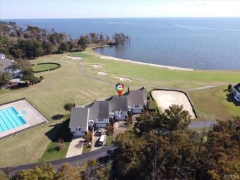 Spectacular views of the 18th green and the Albemarle Sound from on Sound Golf Links at Albemarle Plantation in North Carolina - for sale on GolfHomes.com, golf home, golf lot