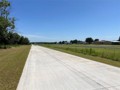 PILOTS! FLY IN to view this stunning 1.28-acre homesite with on Pecan Plantation Country Club in Texas - for sale on GolfHomes.com, golf home, golf lot