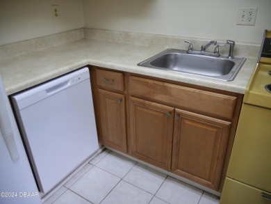 This charming 2-bedroom, 2-bathroom apartment offers a fantastic on Daytona Beach Golf Club in Florida - for sale on GolfHomes.com, golf home, golf lot
