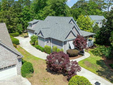 Nestled in a quiet cul-de-sac and backed by a serene pond shaded on Members Club At St. James Plantation in North Carolina - for sale on GolfHomes.com, golf home, golf lot