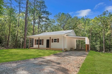 Nestled in the heart of Rayburn Country, this new construction on Rayburn Country Club in Texas - for sale on GolfHomes.com, golf home, golf lot